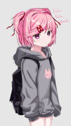  1girl alternate_costume animal_print backpack bag black_bag casual cat_print character_name closed_mouth commentary cowboy_shot doki_doki_literature_club english_commentary grey_background grey_hoodie hair_intakes hair_ornament hair_ribbon hairclip highres hood hood_down hoodie jinzzzzzzzz0222 long_sleeves natsuki_(doki_doki_literature_club) pink_eyes pink_hair red_ribbon ribbon short_hair simple_background sleeves_past_fingers sleeves_past_wrists solo third-party_source two_side_up 