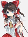  1girl ascot bangs bare_shoulders blue_eyes bow brown_hair collared_vest commentary_request detached_sleeves frilled_bow frilled_hair_tubes frills gohei hair_bow hair_tubes hakurei_reimu highres holding long_sleeves looking_at_viewer medium_hair ponytail ramochi red_bow red_skirt red_vest sidelocks skirt solo touhou vest wide_sleeves yellow_ascot 
