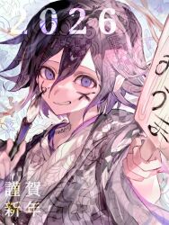  1boy 2026 checkered_clothes checkered_kimono commentary danganronpa_(series) danganronpa_v3:_killing_harmony facepaint flipped_hair gahagahay526 hair_between_eyes holding holding_paddle holding_paintbrush japanese_clothes kimono long_sleeves looking_at_viewer male_focus medium_hair new_year oma_kokichi paddle paintbrush purple_hair ringed_eyes sidelighting smile solo teeth translation_request upper_body violet_eyes 