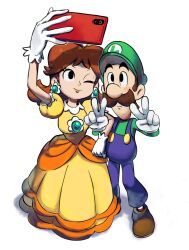  1boy 1girl black_eyes blue_overalls blush brown_hair cellphone commentary dress earrings facial_hair flower_earrings gloves green_hat green_shirt hat highres jewelry locked_arms luigi mari_luijiroh mustache one_eye_closed orange_dress overalls phone princess_daisy puffy_short_sleeves puffy_sleeves selfie shirt short_sleeves simple_background smartphone smile super_mario_bros. untranslatable_commentary v white_background white_gloves 