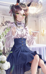  1girl absurdres animal_ears blue_skirt blue_vest blush breasts brown_hair chair chandelier closed_mouth clover_hair_ornament commentary_request cup fine_motion_(umamusume) flower frilled_shirt frills green_eyes hair_between_eyes hair_bun hair_ornament hair_ribbon highres holding holding_cup holding_saucer horse_ears horse_girl long_hair long_sleeves looking_at_viewer mu-to multicolored_hair on_chair ribbon saucer shirt sitting skirt smile solo table teacup umamusume vest white_hair white_shirt 