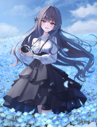  1girl absurdres asymmetrical_sidelocks black_hair black_skirt blue_flower blue_petals blunt_bangs blush bow camera clouds commentary cowboy_shot field flower flower_field frilled_skirt frills hair_bow half_updo highres holding holding_camera long_hair long_sidelocks long_sleeves looking_at_viewer open_mouth original outdoors petals png_pant_(bus) puriel sidelocks skirt sky smile solo standing very_long_hair wind 