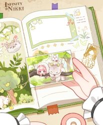  1girl artist_request book bookmark branch brown_background chibi commentary copyright_logo english_commentary female_pov forest frilled_sleeves frills happy highres holding holding_photo infinity_nikki logo long_sleeves momo_(nikki) nature nikki_(nikki) nikki_(series) official_alternate_costume official_art open_book perfect_start_(infinity_nikki) photo_(object) pov purifying_wind_(infinity_nikki) scrapbook second-party_source shadow sproutborne_behemoth_(infinity_nikki) tape 