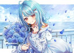 1girl absurdres ahoge blue_flower blue_hair blue_hoodie blue_petals blue_rose blush bouquet commentary falling_petals flower hair_ornament hairclip headphones headphones_around_neck highres hood hoodie letterboxed looking_at_viewer multicolored_hair ocean orange_eyes outdoors outside_border petals rose sasamisable shiranami_ramune solo two-tone_hair virtual_youtuber vspo! white_hair 