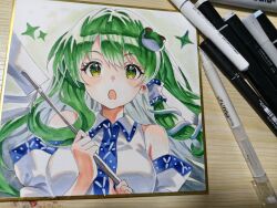  1girl absurdres art_tools_in_frame blush breasts commentary detached_sleeves frog_hair_ornament gohei green_eyes green_hair hair_ornament hair_tubes highres holding holding_gohei kochiya_sanae l0e9s29p large_breasts long_sleeves looking_at_viewer open_mouth photo_(medium) shikishi single_hair_tube snake_hair_ornament solo touhou traditional_media 