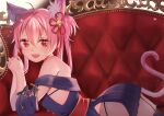  absurdres animal_ear_fluff animal_ears azur_lane bell bikini cat_ears cat_tail couch dress fang flower_knot garter_straps hair_bell hair_ornament hair_rings hatsushimo_(azur_lane) highres looking_at_viewer lying on_stomach open_mouth own_hands_together panties pink_hair pleated_dress red_eyes ribbon sash skirt smile string_bikini string_panties swimsuit tail thigh-highs underwear 