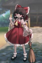  1girl ascot bow broom brown_hair commentary_request detached_sleeves frilled_bow frilled_hair_tubes frilled_skirt frills full_body hair_bow hair_tubes hakurei_reimu hakurei_shrine highres holding holding_broom long_hair modokith open_mouth red_bow red_eyes red_skirt ribbon-trimmed_skirt ribbon-trimmed_sleeves ribbon_trim skirt skirt_set solo touhou translation_request yellow_ascot 