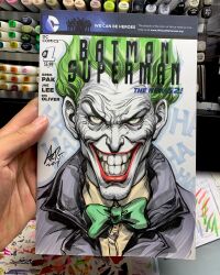  art_tools_in_frame artist's_hand_in_frame batman_(series) black_jacket bow bowtie clown commentary cover_sketch dc_comics english_commentary evil_smile green_bow green_bowtie green_eyes green_hair highres jacket joker_(dc) looking_at_viewer marker_(medium) photo_(medium) shirt signature smile stanley_lau straight-on traditional_media white_facepaint yellow_shirt 