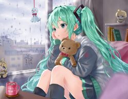  1girl absurdres black_skirt black_socks character_doll commentary_request cup doll double-parted_bangs feet_out_of_frame glass_writing green_eyes green_hair grey_jacket hair_between_eyes hatsune_miku head_rest highres indoors jacket kagamine_len kagamine_rin kneehighs long_hair long_sleeves miniskirt mug nn_(user_mrrd4858) parted_lips pleated_skirt rain sitting skirt socks solo stuffed_animal stuffed_toy teddy_bear twintails very_long_hair vocaloid window 