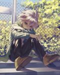  1boy bangs bei_meng_zi black_pants brown_footwear chain-link_fence danganronpa_(series) danganronpa_2:_goodbye_despair fence flower green_jacket grey_eyes grey_hair highres hood hood_down jacket komaeda_nagito long_sleeves outdoors pants shiny shiny_clothes shiny_hair sitting solo stairs tree 