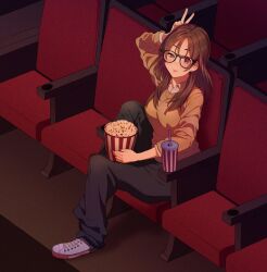  1girl black_pants brown_eyes brown_hair brown_sweater commentary cup disposable_cup food glasses holding indoors kyougetsu_(junrai) long_hair looking_at_viewer movie_theater original pants popcorn popcorn_bucket shirt shoes sitting sneakers solo sweater untranslatable_commentary v white_shirt 