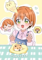  1girl animal_ears blue_overalls blush commentary_request cuddling green_eyes hamster hamster_ears highres hoshizora_rin long_sleeves love_live! love_live!_school_idol_project open_mouth orange_hair overalls pink_shirt shirt sitting solo speech_bubble table tukiwa_poyo 