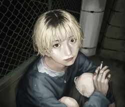 1girl between_fingers black_nails black_pants blonde_hair brown_eyes chain-link_fence cigarette closed_mouth commentary_request ear_piercing earrings fence gold_earrings gold_necklace highres holding holding_cigarette jewelry lips long_sleeves makko_(user_kvud5535) multicolored_hair multiple_rings nail_polish necklace night nose original outdoors pants piercing realistic reverse_trap ring roots_(hair) shirt short_hair solo torn_clothes torn_pants 