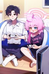  1boy 1girl :d absurdres ahoge alternate_costume black_eyes black_hair black_pants blue_archive blue_eyes blue_pants blush butterfly_sitting capry commentary controller fang game_console game_controller hair_between_eyes hair_flaps halo heterochromia highres holding holding_controller holding_game_controller hoshino_(blue_archive) huge_ahoge indian_style indoors long_hair open_mouth pants pink_hair pink_halo playstation_5 sensei_(blue_archive) shirt short_hair shorts single_off_shoulder sitting smile under_covers very_long_hair white_shirt yellow_eyes 
