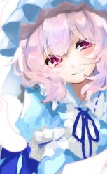  1girl blue_bow blue_hat blush bow commentary falling_petals frilled_hat frills hat highres k4iwa_u looking_at_viewer open_mouth petals pink_eyes pink_hair saigyouji_yuyuko smile solo touhou untranslatable_commentary 