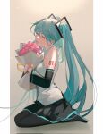  1girl aqua_hair bangs bare_shoulders black_footwear black_pantyhose black_skirt black_sleeves bouquet breasts closed_mouth denpa0304 detached_sleeves flower full_body grey_background grey_shirt hair_between_eyes hair_ornament hatsune_miku highres holding holding_bouquet kneeling long_hair long_sleeves medium_breasts number_tattoo open_mouth own_hands_together pantyhose pillarboxed pink_flower shirt skirt sleeveless sleeveless_shirt smile solo tattoo twintails vocaloid 