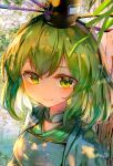  1girl bangs blush breasts closed_mouth commentary_request dress green_dress green_eyes green_hair hat highres itsumizu japanese_clothes looking_at_viewer medium_breasts no_nose outdoors short_hair smile soga_no_tojiko solo tate_eboshi touhou upper_body 