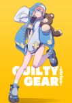 1girl absurdres androgyne_symbol aqua_eyes bare_legs blonde_hair blue_footwear blue_jacket bridget_(guilty_gear) clothes_pull commentary copyright_name dress english_commentary full_body guilty_gear guilty_gear_strive habit hand_up head_tilt hej highres jacket looking_at_viewer open_clothes open_jacket roger_(guilty_gear) shadow shoes short_hair simple_background smile socks solo stuffed_animal stuffed_toy teddy_bear transgender white_socks yellow_background yellow_dress zipper