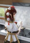  1girl absurdres apron bangs black_skirt brown_hair closed_mouth collared_shirt cooking cooking_pot counter egg_(food) fasnakegod food from_behind hat highres holding holding_ladle ladle looking_to_the_side pointy_ears pom_pom_(clothes) puffy_sleeves red_eyes red_headwear reflection shameimaru_aya shirt short_hair short_sleeves sink skirt smile solo steam stove tengu tokin_hat touhou white_shirt white_sleeves window yellow_apron 