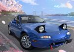  absurdres blue_sky bridge car cherry_blossoms clouds commentary_request day eunos_roadster ground_vehicle guard_rail highres masa_(siriusu-koko) mazda motor_vehicle mountainous_horizon no_humans original outdoors road sky sports_car suspension_bridge tree vehicle_focus 