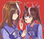  2girls animal_ears blue_eyes brown_hair ear_bow earrings food hair_between_eyes horse_ears horse_girl jewelry kusanagi_kaoru long_hair long_sleeves multicolored_hair multiple_girls pocky pocky_in_mouth purple_serafuku red_background school_uniform serafuku single_earring streaked_hair symboli_rudolf_(umamusume) tokai_teio_(umamusume) tracen_school_uniform umamusume violet_eyes 