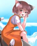  1girl :d animal_ears blue_sky brown_hair cat_ears cat_tail chen day earrings fang hand_on_own_face highres jewelry kashiwara_mana multiple_tails nekomata no_headwear ocean open_mouth sitting sky smile solo tail touhou two_tails 
