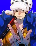 1boy beard black_hair blue_background chest_tattoo earrings english_text facial_hair fingers fur_trim goatee hat highres holding jewelry male_focus myu_ebie one_piece short_hair sideburns simple_background smile solo sword tattoo trafalgar_law weapon yellow_eyes 