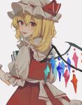  1girl bangs blonde_hair book closed_mouth commentary cowboy_shot crystal fangs flandre_scarlet from_behind grey_background hair_between_eyes hat hat_ribbon highres holding holding_book long_hair looking_at_viewer looking_back mob_cap one_side_up open_mouth puffy_short_sleeves puffy_sleeves red_eyes red_ribbon red_skirt red_vest ribbon shirt short_sleeves skirt solo symbol-only_commentary teeth touhou vest white_headwear white_shirt wings yanfei_u 