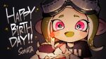 1girl :d black_shirt blush cake candle colored_tongue ear_blush fire food goggles goggles_on_head green_hair green_tongue happy_birthday highres inari1369 long_hair octarian octoling octoling_girl open_mouth pink_eyes shirt short_sleeves smile solo splatoon_(series) t-shirt tentacle_hair upper_body 