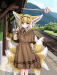  1girl :o absurdres animal_ear_fluff animal_ears arknights bangs black_hairband blonde_hair blue_sky blush braid briefcase brown_jacket brown_skirt clouds commentary day english_commentary fox_ears fox_girl fox_tail green_eyes hair_between_eyes hair_rings hairband hand_up highres holding jacket kyuubi layered_sleeves long_sleeves looking_at_viewer mountain multicolored_hair multiple_tails outdoors parted_lips pleated_skirt railroad_tracks rylaera shirt short_over_long_sleeves short_sleeves skirt sky solo suzuran_(arknights) tail train_station train_station_platform tree twin_braids two-tone_hair white_hair white_shirt 