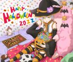  1girl bat_(animal) bed blush candy cosplay detached_sleeves eiyuu_densetsu fie_claussell food green_eyes hat highres jack-o&#039;-lantern lollipop sen_no_kiseki short_hair sitting solo stuffed_animal stuffed_toy thigh-highs white_hair witch witch_f witch_hat 