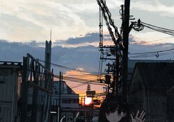  1girl absurdres black_eyes black_hair building clouds evening gradient_sky hand_up head_only highres house orange_sky original outdoors power_lines scenery sky solo sun sunset traffic_light uniunimikan upper_body utility_pole 