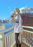  1girl bangs black_footwear black_pantyhose blue_sky boots breasts closed_mouth commentary day dress flag grey_dress grey_eyes grey_hair highres japanese_flag kantai_collection long_hair long_sleeves looking_at_viewer medium_breasts nidou outdoors pantyhose photo_background railing ship sidelocks sky solo standing very_long_hair washington_(kancolle) water watercraft 