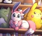  book bookshelf character_doll highres no_humans otakuap photo_(object) pikachu poke_ball pokemon pokemon_(creature) smile solo substitute_(pokemon) sylveon 