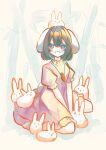  1girl :d animal_ears animal_on_head arm_support between_legs black_hair blush carrot_necklace commentary dress full_body hair_between_eyes hand_between_legs highres inaba_mob_(touhou) inaba_tewi jewelry looking_at_viewer medium_hair necklace on_head pink_dress puffy_short_sleeves puffy_sleeves rabbit_ears rabbit_girl rabbit_tail red_eyes sabatuki short_sleeves sitting smile solo tail touhou wariza 