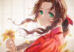  1girl a_la_votre aerith_gainsborough bangs blurry blurry_background braid braided_ponytail final_fantasy final_fantasy_vii final_fantasy_vii_remake flower green_eyes hair_ribbon highres holding holding_flower indoors lily_(flower) long_hair looking_at_viewer parted_bangs parted_lips pink_ribbon ribbon sidelocks smile solo upper_body wavy_hair yellow_flower 