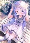  1girl ;d arms_up bangs blue_eyes blue_hair blurry blurry_background blush chinomaron commentary_request day depth_of_field dress feet_out_of_frame flower flower_wreath gochuumon_wa_usagi_desu_ka? grey_sailor_collar hair_between_eyes hair_ornament head_wreath highres jacket kafuu_chino long_hair looking_at_viewer on_bench one_eye_closed outdoors petals sailor_collar sailor_dress short_sleeves sitting smile solo thigh-highs very_long_hair white_dress white_flower white_jacket white_thighhighs x_hair_ornament 