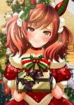 1girl animal_ears blurry blurry_background blush brown_hair christmas collarbone gift gloves hair_ornament highres horse_ears horse_girl medium_hair nice_nature_(umamusume) otono_(bkt4b) presenting redhead santa_costume smile solo twintails umamusume