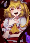  1girl :d absurdres arm_under_breasts ascot bangs blonde_hair blurry blush crystal depth_of_field fangs flandre_scarlet hair_between_eyes hand_up hat highres izanaware_game laevatein_(touhou) looking_at_viewer medium_hair mob_cap nail_polish open_mouth outer_glow perspective puffy_short_sleeves puffy_sleeves red_background red_eyes red_nails red_skirt red_vest short_sleeves skirt skirt_set sleeves_past_wrists smile solo teeth tongue touhou upper_body vest wings wrist_cuffs yellow_ascot 