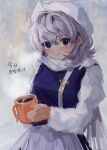  1girl b_nosk101 blue_eyes blue_vest blush closed_mouth cup grey_hair hair_between_eyes hat highres holding holding_cup lapel_pin letty_whiterock long_sleeves looking_at_viewer medium_hair mug shirt skirt smile solo touhou translated upper_body vest white_headwear white_shirt white_skirt 