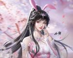 1girl animal_ears artist_request black_hair blurry blurry_background blush branch cherry_blossoms closed_mouth collar douluo_dalu dress facial_mark falling_petals forehead_mark hair_ornament hand_up highres looking_at_viewer metal_collar petals pink_dress ponytail rabbit_ears second-party_source solo upper_body xiao_wu_(douluo_dalu) 