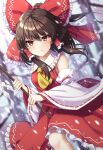  1girl absurdres ascot bare_shoulders blurry blurry_background bow breasts brown_hair day depth_of_field detached_sleeves dutch_angle feet_out_of_frame frilled_bow frilled_hair_tubes frilled_shirt_collar frills gohei hair_bow hair_tubes hakurei_reimu highres holding looking_at_viewer medium_breasts nontraditional_miko outdoors petticoat red_bow red_skirt ribbon-trimmed_sleeves ribbon_trim sarashi serious sidelocks skirt snowing solo touhou tree v-shaped_eyebrows wide_sleeves yellow_ascot yosshy 