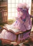  1girl bangs bespectacled blue_bow book bookshelf bow chair closed_mouth crescent crescent_hat_ornament cup dress frilled_sleeves frills glasses hair_bow hat hat_ornament highres holding holding_cup kyusoukyu long_hair long_sleeves mob_cap open_book patchouli_knowledge purple_hair red_bow round_eyewear sidelocks sitting solo striped striped_dress touhou vertical-striped_dress vertical_stripes violet_eyes white_headwear wide_sleeves 