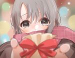  1girl blush brown_coat coat covered_mouth foreshortening gift grey_hair highres idolmaster idolmaster_cinderella_girls looking_at_viewer otokura_yuuki plaid plaid_scarf reaching_towards_viewer scarf solo valentine yuukura_yuu 