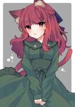  1girl adapted_costume alternate_hairstyle animal_ear_fluff animal_ears blush border cat_ears cat_tail dress green_dress highres kaenbyou_rin long_hair long_sleeves multiple_tails necono_(nyu6poko) parted_lips red_eyes redhead sidelocks skull_print solo tail touhou two_tails upper_body white_border 