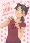  1girl ami_yamato animal_ears anniversary bangs black_hair blue_pants brown_eyes cat_ears collarbone commentary commission cowboy_shot english_commentary english_text highres light_blush medium_hair midori_matsui original pants paw_pose paw_print paw_print_background pink_background ponytail red_shirt second-party_source shirt slit_pupils smile solo swept_bangs t-shirt 