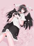 1girl bird_wings black_hair black_skirt black_wings camera cherry_blossoms expressionless feathered_wings hat highres holding holding_camera knees_together_feet_apart lying on_back petals pink_background pom_pom_(clothes) red_eyes ribbon shameimaru_aya short_hair skirt solo tohoyuukarin tokin_hat touhou wings 