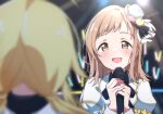  2girls ahoge blonde_hair blurry blurry_background blurry_foreground blush bow brown_eyes brown_hair dot_nose dress feathers glowstick hachimiya_meguru hair_ornament hat highres holding holding_microphone idolmaster idolmaster_shiny_colors long_hair long_sleeves looking_at_another low_twintails microphone mini_hat multiple_girls open_mouth reikakrzk ribbon sakuragi_mano smile spotlight stage stage_lights staring twintails white_dress 