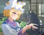  1girl black_cat blonde_hair blurry blurry_background cat chen chen_(cat) closed_eyes closed_mouth commentary ear_piercing green_headwear hat highres long_sleeves looking_at_another mob_cap multiple_tails nekomata piercing short_hair tabard tail tasuku_(tusktouhou4) touhou two_tails upper_body white_headwear yakumo_ran yellow_eyes 