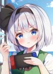  1girl :&lt; black_hairband blue_eyes blue_sky blush closed_mouth clouds commentary_request controller flying_sweatdrops game_controller grey_hair hairband highres holding holding_controller holding_game_controller konpaku_youmu nintendo_switch shirotsuki_shirone short_hair sky solo touhou upper_body 